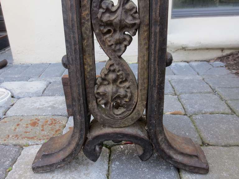 Pair of 20th century wrought iron andirons in the style of Liberty.