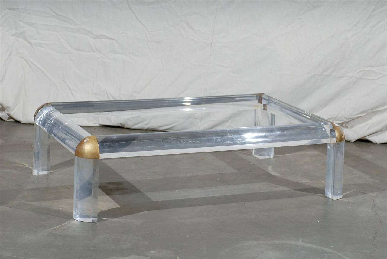 Circa 1970s Lucite, Brass, Glass Coffee Table Attributed to Maison Jansen. Glass top