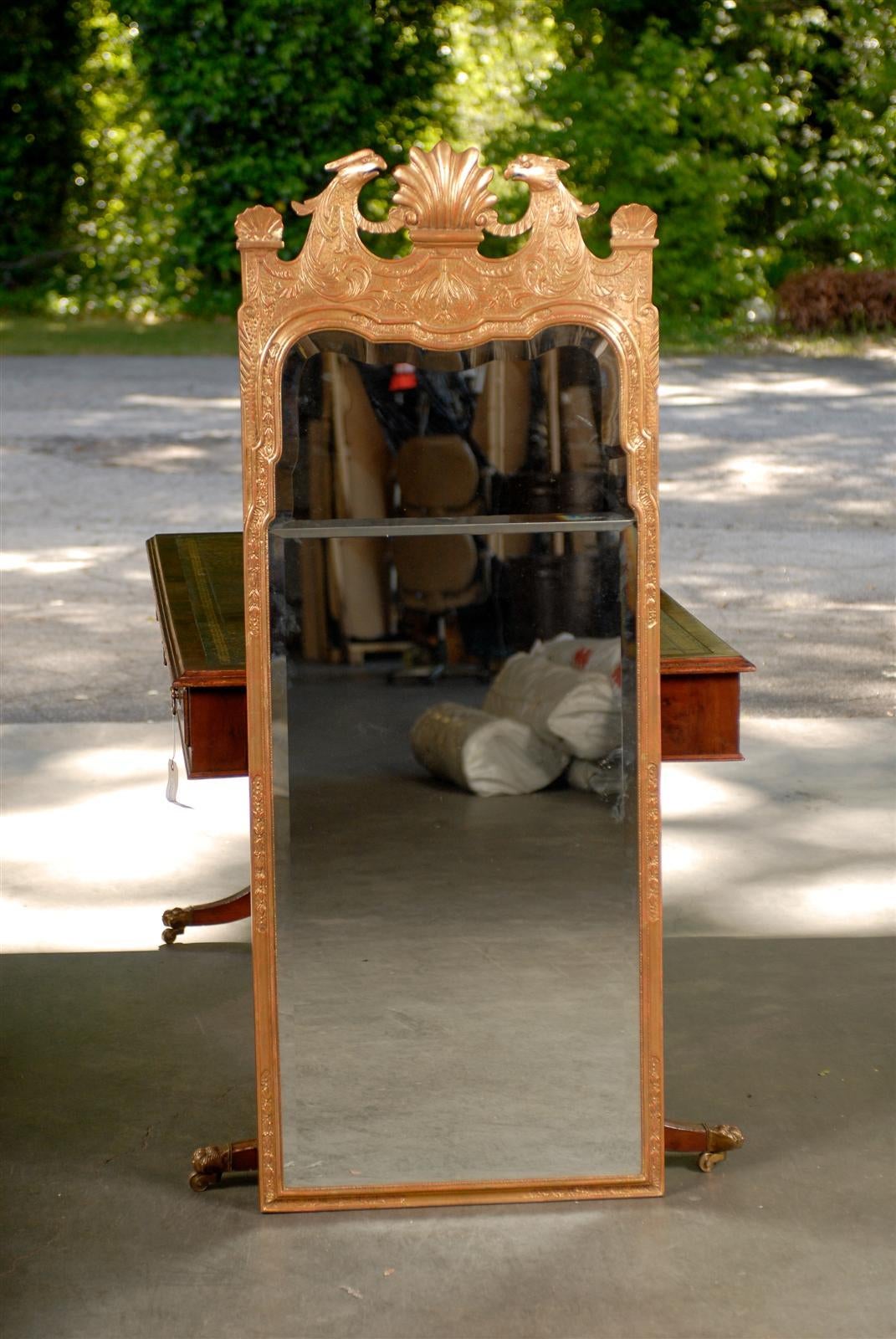 20th century George III style gilt mirror, bird and shell.