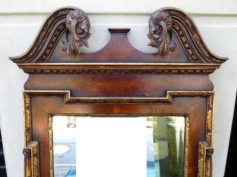 Early 20th century Chippendale style walnut and parcel mirror.