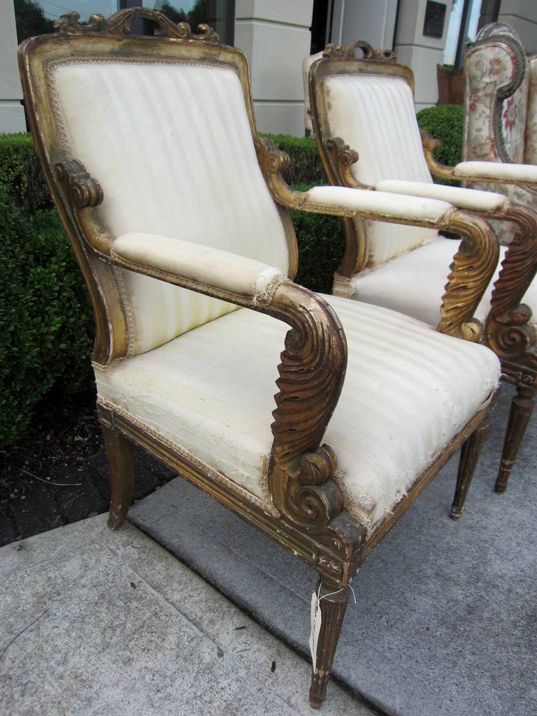 19thc pair of carved giltwood armchairs, probably period regency