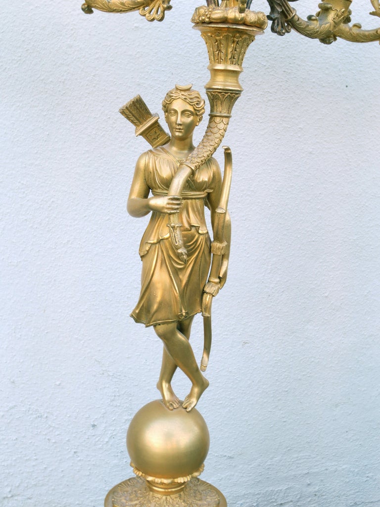 Pair of 19th century Charles X gilt bronze figural ormolu candelabra.