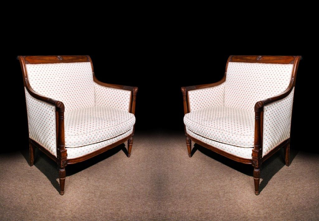 # T221 - Attractive pair of Directoire marquises. This elegant form embodies the simple restrained elegance that typifies the Directoire period. Constructed in mahogany which gives both strength and utility the small upholstered back and seat