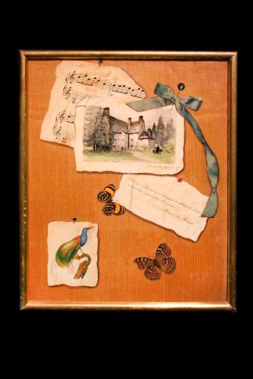 # V046 - Charming trompe l'oeil painting depicting decorative elements including a French quote from Balzac about the Chateau de Sache, a watercolor of the chateau, music, ribbon, and butterflies all on a faux bois ground.
French, Mid 19th