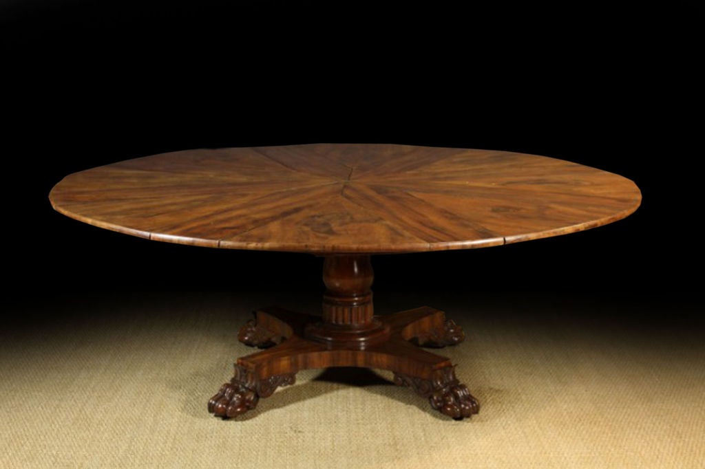 An Impressive 19th Century Walnut Capstan Dining Table stamped 'Johnstone Jupe and Co.', patentees of the Circular Dining Tables, No. 67 'New Bond Street, London 1824'. The circular top divided into eight sections which extend to incorporate eight