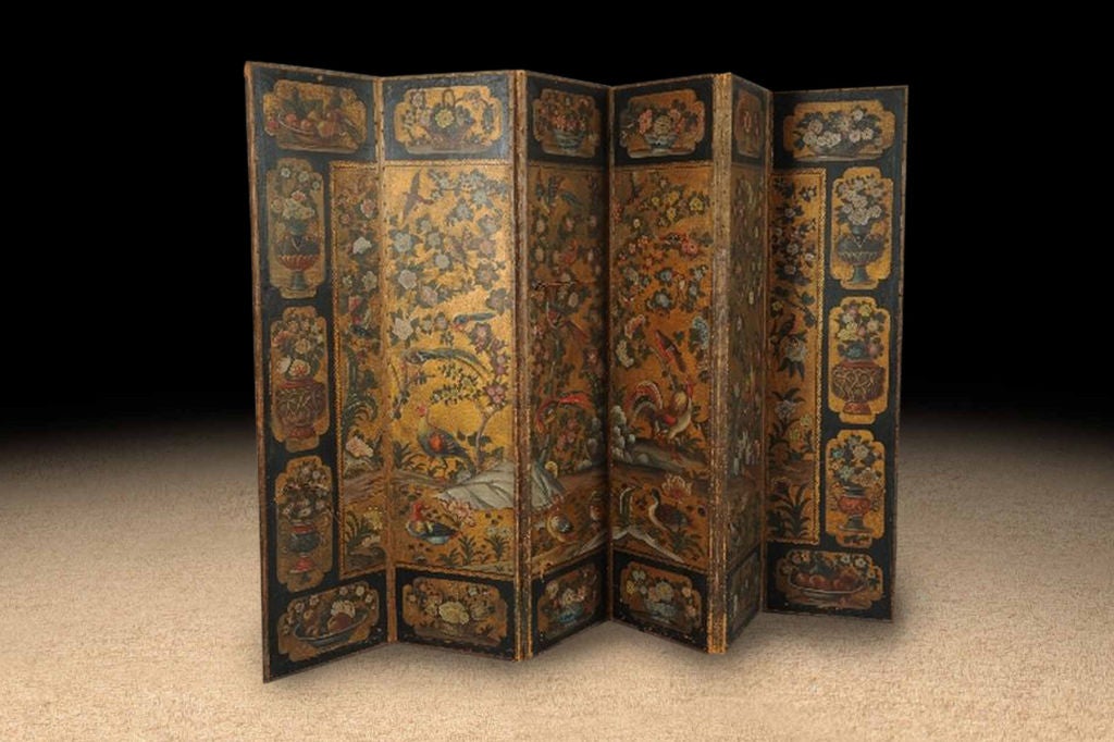 Anglo Dutch six panel leather and polychrome painted gilt screen in the Chinese manner.  Featuring exotic birds in a garden setting of peony and other blossom trees within a black border of lozenge-shaped panels containing urns and baskets of