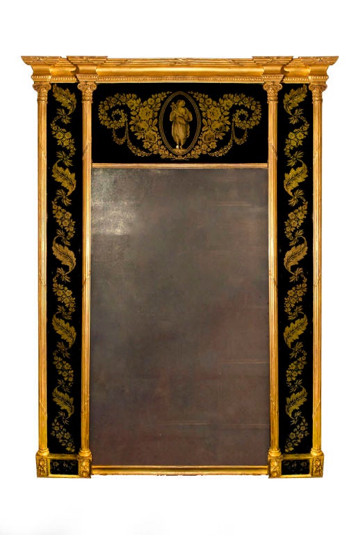 # W046 - Regency gilt composition and verre églomisé pier mirror attributed to Thomas Fentham. The large central rectangular mirror plate with an architectural inspired framework with foliate and flowering double pilasters flanking black and gold