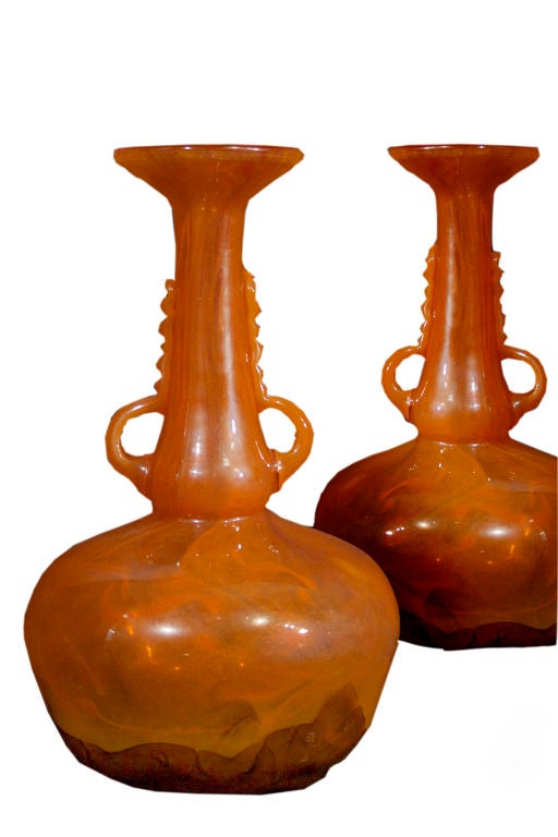 # W063 - Pair of Art glass vases by Schneider, France. The artistic swirled transparent orange glass shading to burnt orange enhances the unusual shaping. Always innovative, Schneider created a new technique of 