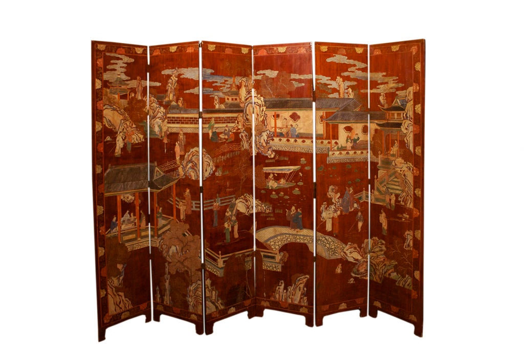 Chinese coromandel six panel screen having a rich brown cordovan background lacquer color and depicting a continuous architectural landscape scene with figures amongst pavilions. The reverse with a classical arrangement of  stylized bird and lotus