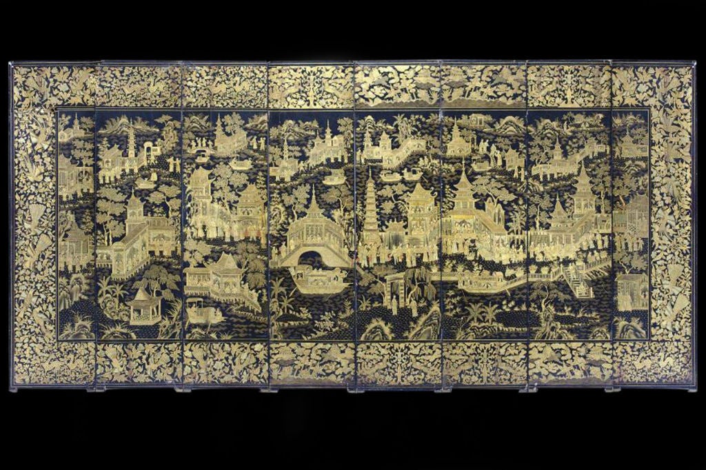 #W071 - Chinese black lacquered and gilt decorated 8 panel screen made for the export market. The intricate wide floral border surrounds a chinoiserie scene of pagodas gardens all in a fanciful landscape. Lacquer was invented and perfected by the