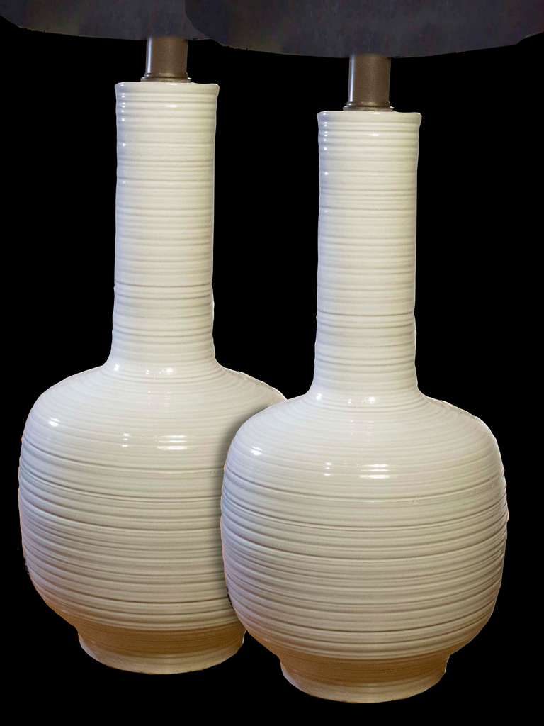 # A1016 - Dramatic PAIR Mid-Century white glazed pottery table lamps by Phil Mar Corp. Cleveland, Ohio. The overall ribbed horizontal pattern on the elongated necks and bulbous form bases. vase ht. 22