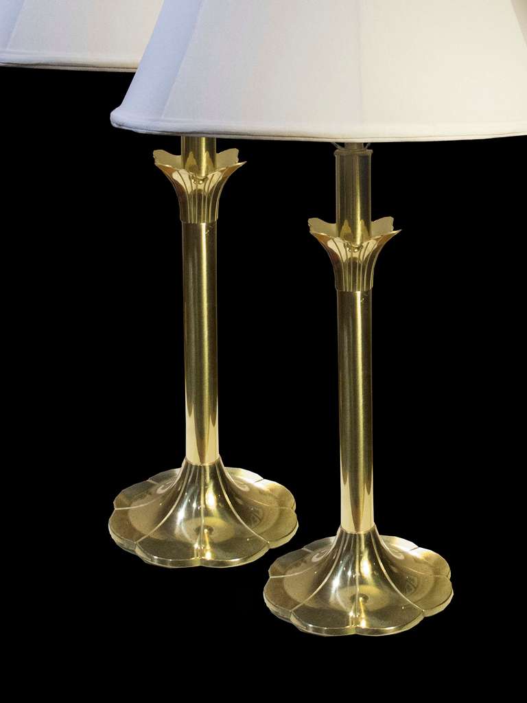 # A1027 - PAIR Mid-Century Modern brass tulip form lamps by Stiffel in the style of Parzinger (still retaining the original Stiffel label). The stylized petal form splayed top above round stems ending in a petal form base. 
American, Circa 1960 