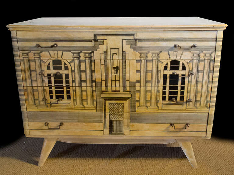 # A521 - Fornasetti style decorated commode having neoclassical inspired architectural building façade decorated front and sides. All raised on short flare legs.
Piero Fornasetti (1913-1988) was an Italian painter, sculptor, interior decorator and