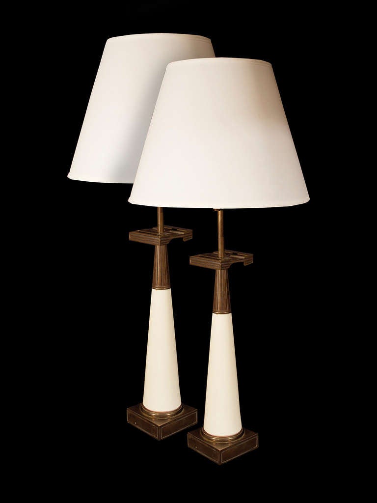 # A524 - PAIR American Stiffel lamps with stylized Greek key capitals above inverted conical white lacquered bodies all resting on plinth bases.
(shades not included)
American, Circa 1960

See similar examples on our website.  

Florian Papp,