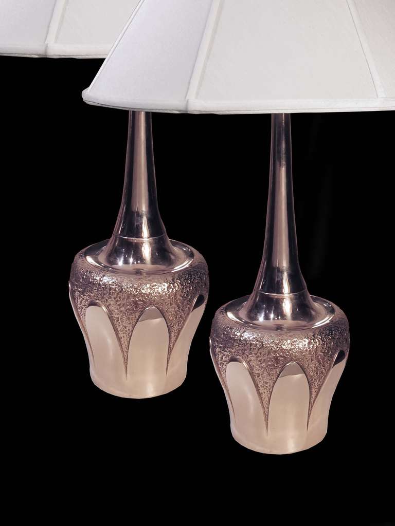 # A532 - PAIR Mid-Century Modern metal table lamps. The elongated necks with decorative detailing suggesting glazing dripped over the jar shaped base.
(shades not included)
American, Circa 1960

See similar examples on our website.  

Florian