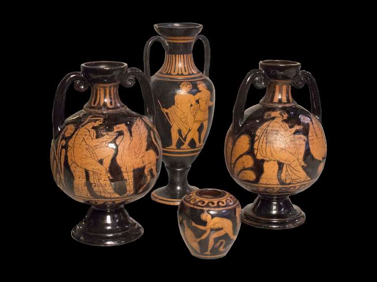 # A1044 - Set of four Grand Tour ceramic vessels. The two aryballos are from Naples, and one depicts a female figures seated feeding a swan on a black ground the other with a male figure feeding a griffin. both are 6 1/2â€. The taller 7 1/2