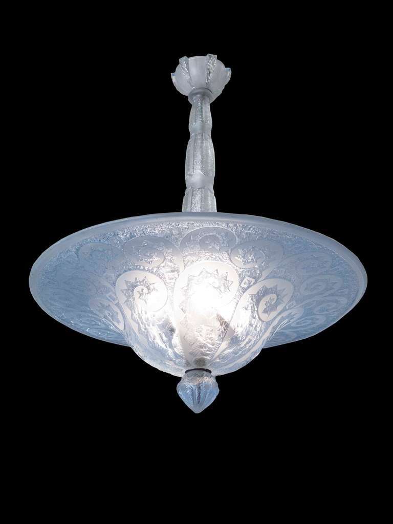 Fabulous Acid Etched Glass Chandelier by Daum. The chandelier is is signed “Daum Nancy France” with the Cross of Lorraine. The top has a glass canopy with a tapering stem above a domed diffuser finely decorated with graceful scrolls on a frosted