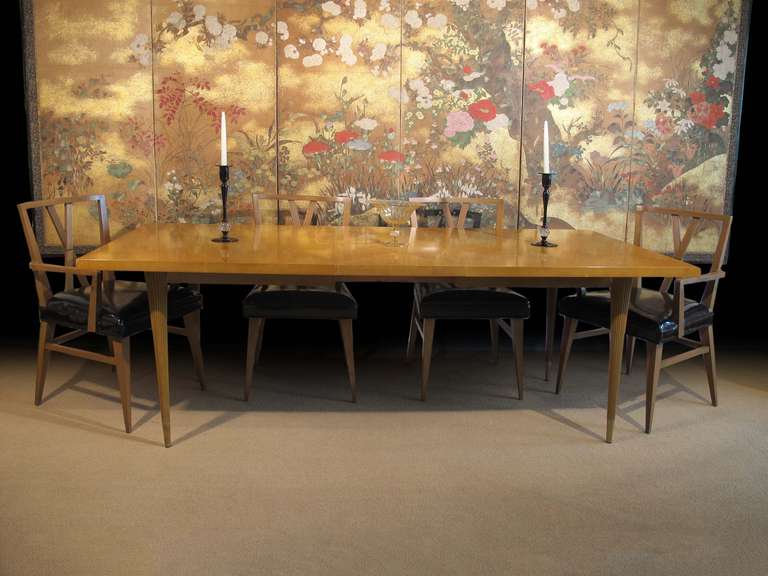 # ZA1030 - Tommi Parzinger designed dining set (table, two armchairs, four side chairs). The rectangular table top with inlaid diamond pattern can expand from 68â€ to 102â€ accommodating two 17â€ leaves. All raised on tapering fluted legs. The