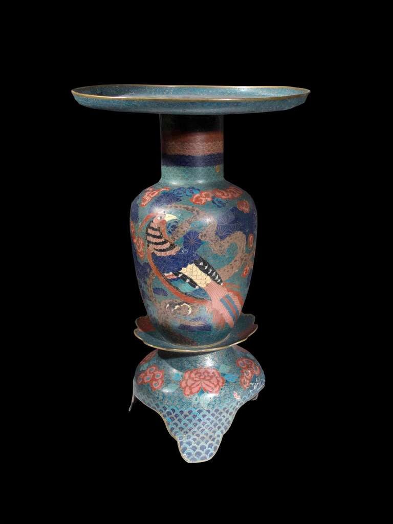 # W524 - Chinese polychrome cloisonnéâ??s polychrome vase. The baluster form with boldly elongated flared top and resting on stylized lotus petal form base. 
The art of cloisonné started in China in the 14th century and in the late 18th century
