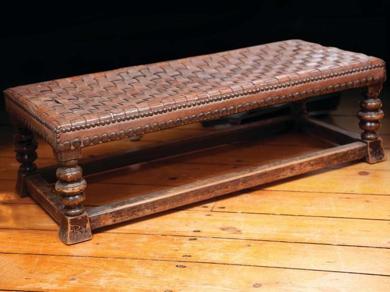 # X017 - Woven leather stool surmounting English oak frame having turned supports in slightly tapered feet.
English, 1910

See similar examples of benches, taborets, ottomans, poufs and stools on our web site florianpapp.com

Florian Papp, fine