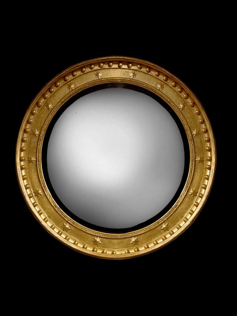 English Regency Giltwood and Ebonized Convex Mirror, circa 1810