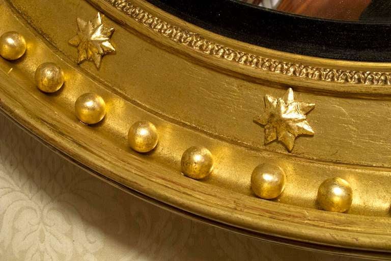 Regency Giltwood and Ebonized Convex Mirror, circa 1810 1