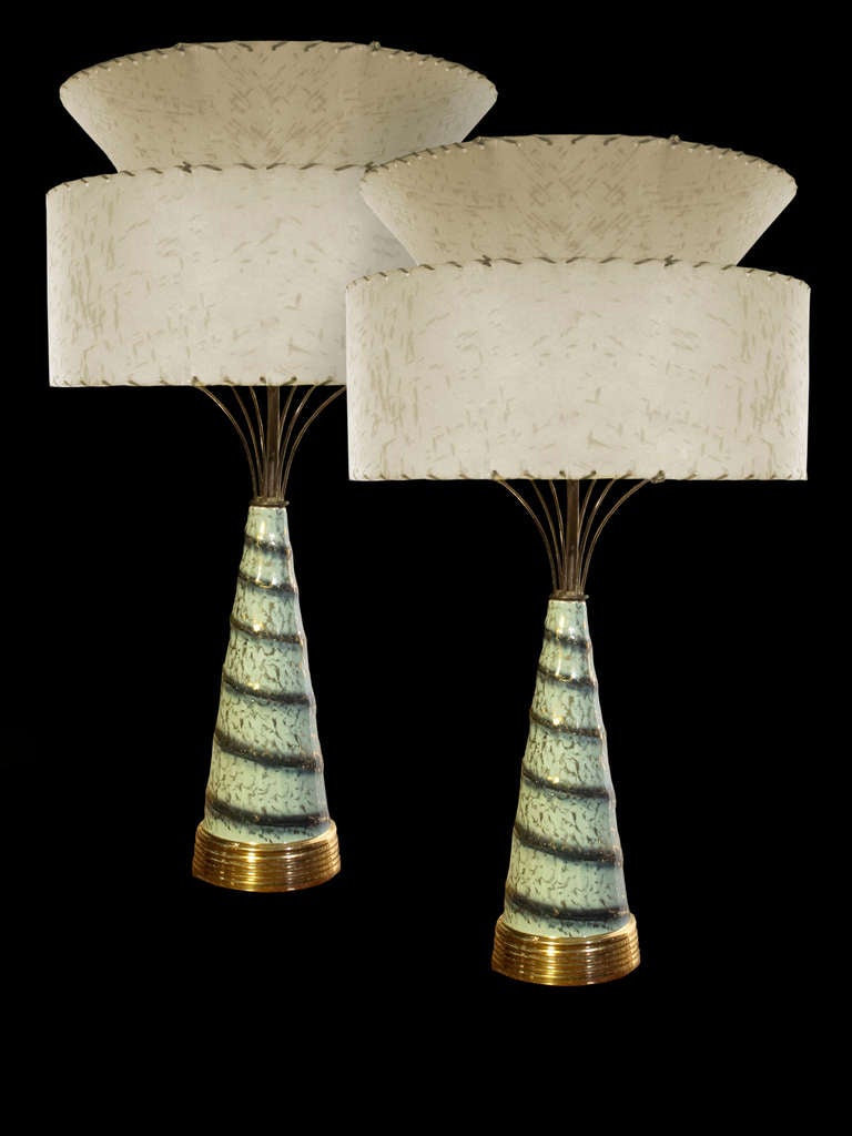 Pair atomic mid-century era lamps having dark green swirled bands over light green background with hints of blue and gold “splatter” decoration.

Florian Papp, fine antiques in our New York gallery since 1900.