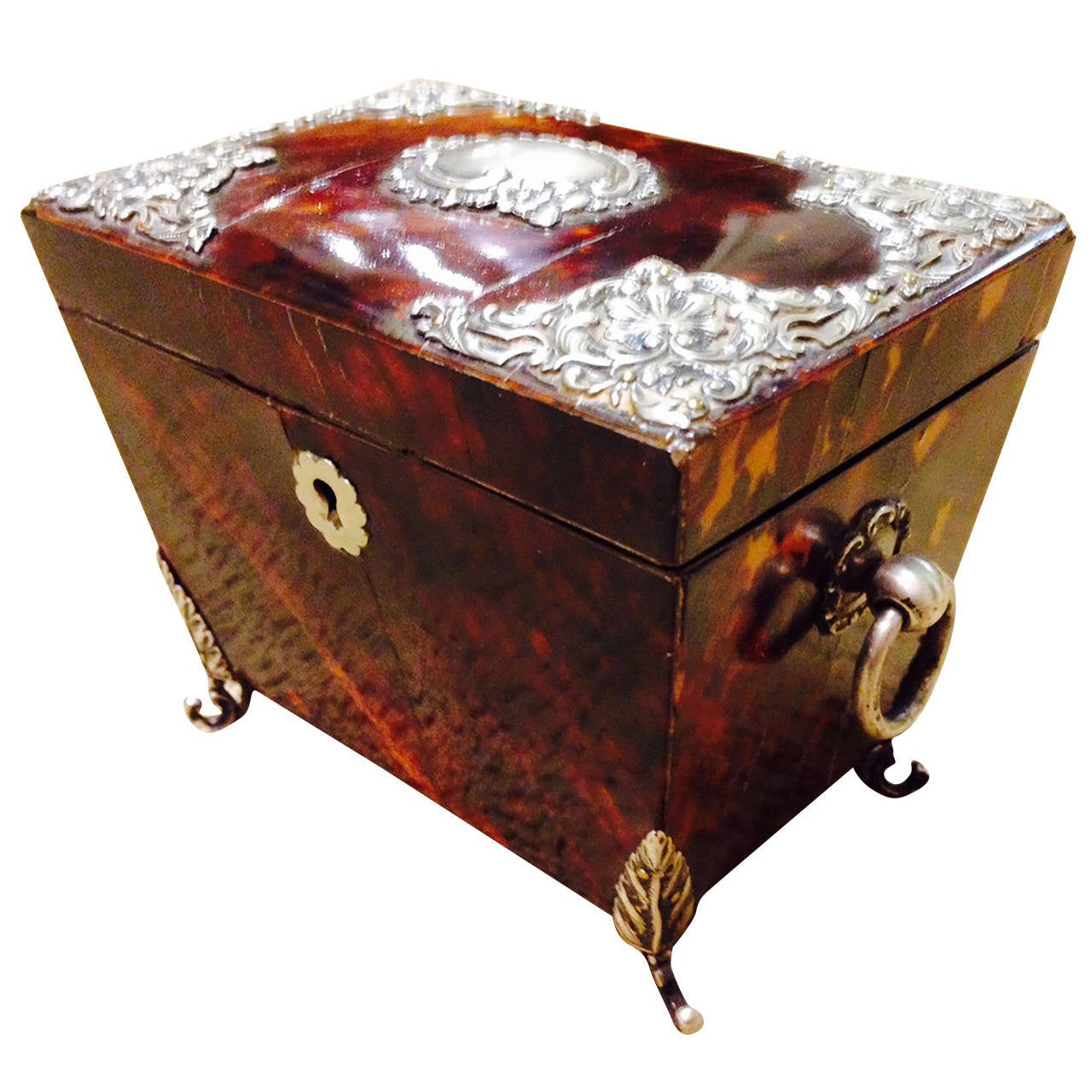 # ZA627 - Regency tortoise shell tea caddy with chased silver mounts,
English, circa 1880.

Click on 