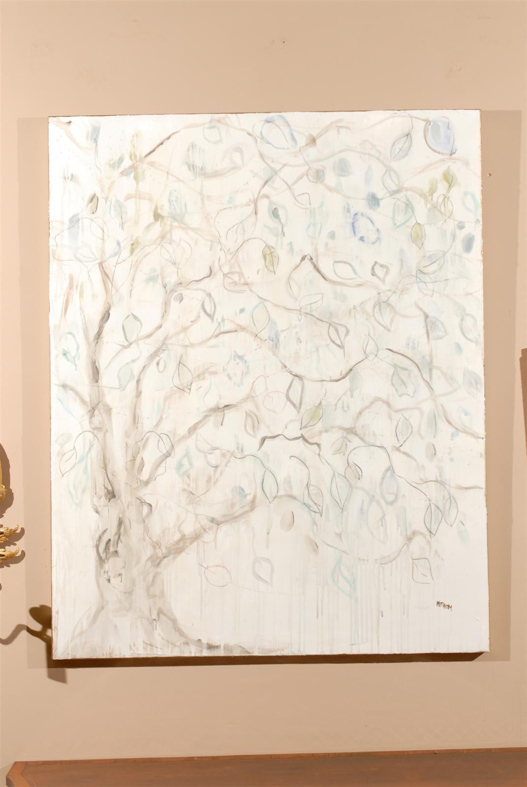 A large lovely original painting of a tree with leaves in neutral colors and some light aqua leaves. It is signed on the lower right