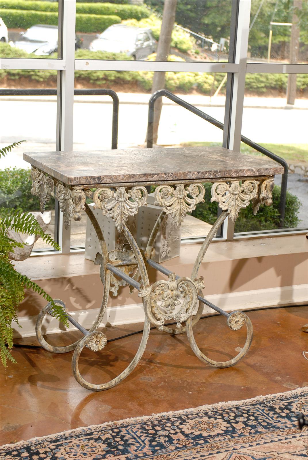 One of a kind pastry table made from old iron with a new marble top. The marble is Braccia Nouvelle. May be used outdoors.