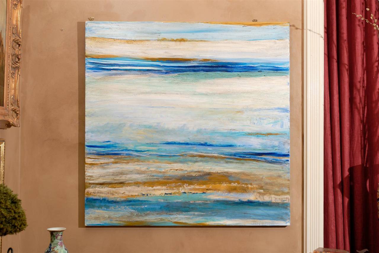 A beautiful modern painting with shades of blue, tan and white. Acrylic on canvas. It is signed on the lower right hand corner.