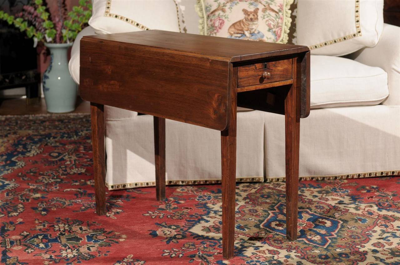 A nice drop-leaf table with inlay on the legs. The width is 14 in. with the sides down.