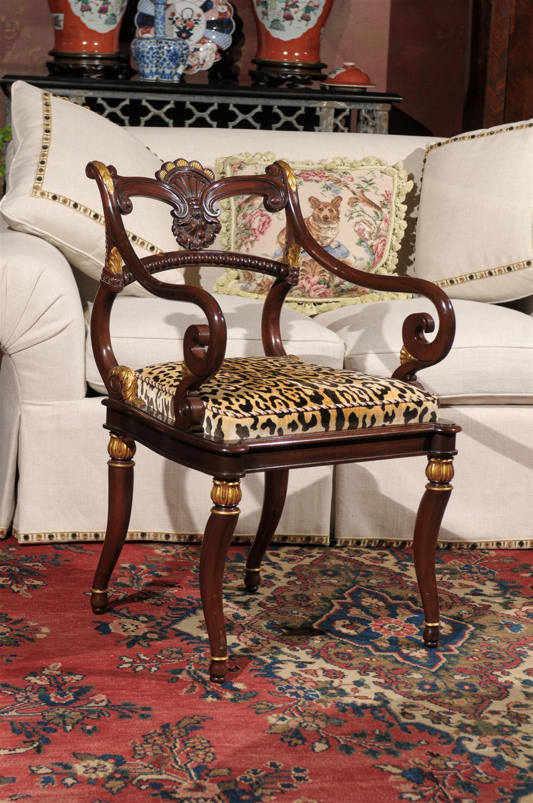 This is a beautiful elegant armchair. Could be a perfect desk chair or stand alone. It was made by Smith and Watson Cabinetmakers , New York. Notice the beautiful carved shell on the back of the chair. The seat in upholstered in an animal print