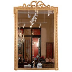 Tall 19th Century French Water Gilt Mirror w/ a Bow at the Crown