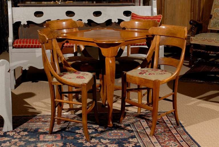 Card table with inlaid Normandy stars. 4 chairs with needlepoint seats.