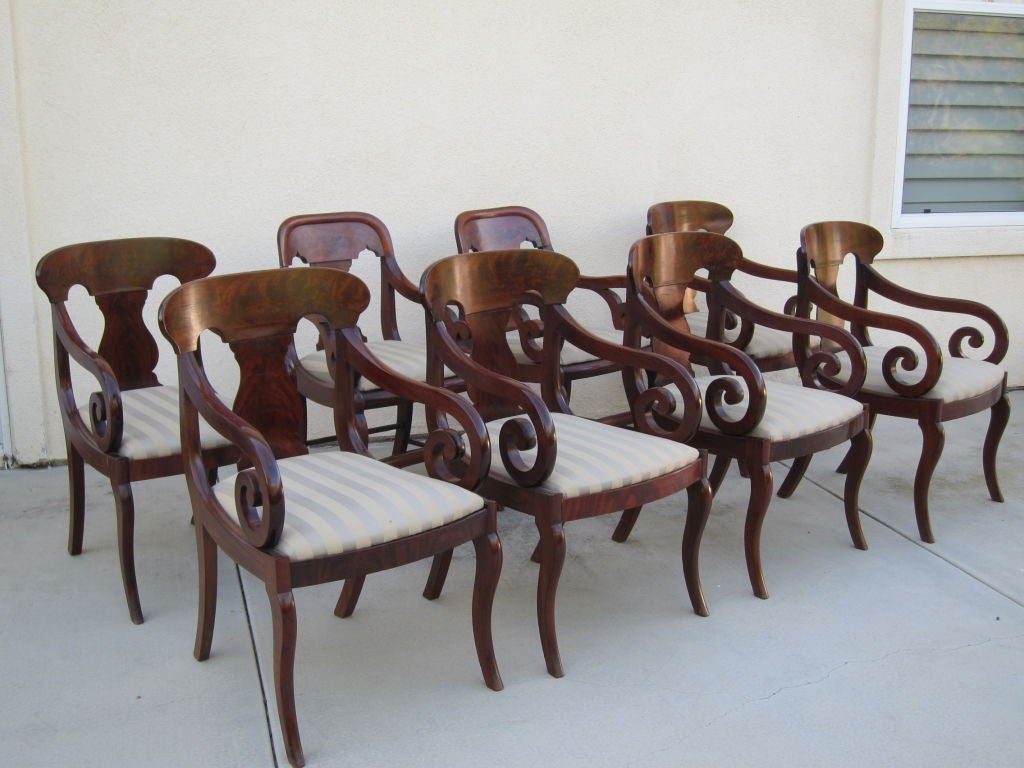 An extremely rare set of eight arm chairs with a family provenance.  Made in New York in the style of Meeks, these chairs were commissioned by a New York  family where they descended through the family in Texas until the sale of the set of six at