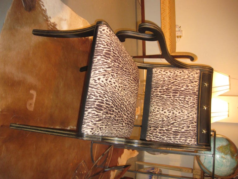 Chic pair of Regency style chairs upholstered in faux leopard