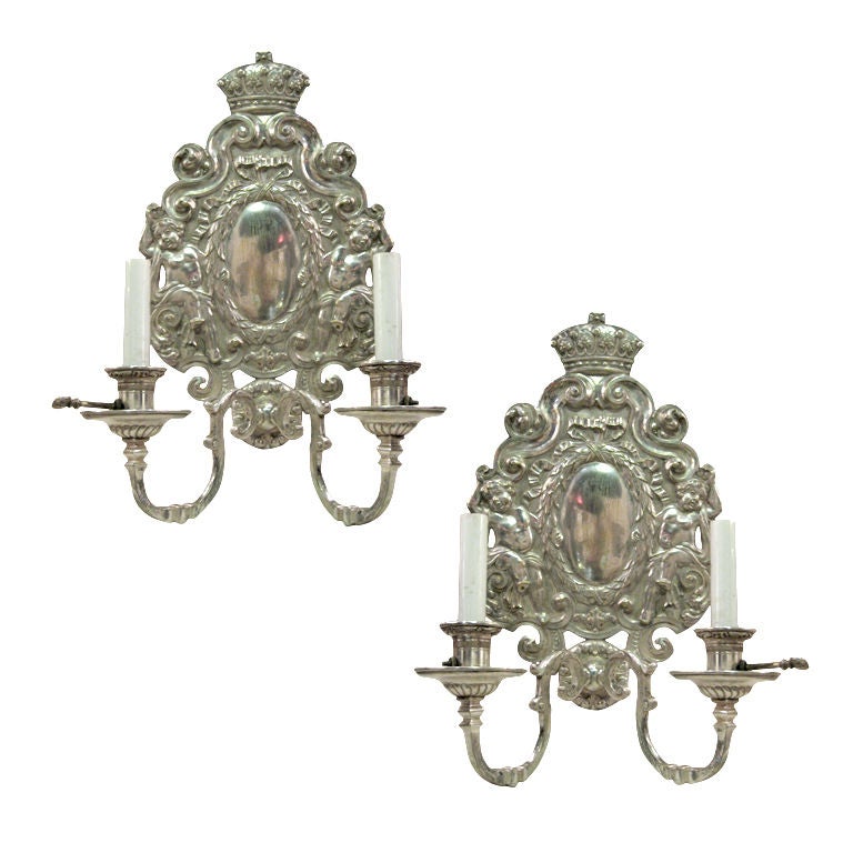 Pair Of Silver Plated Sconces With Cherubs On The Backplate For Sale