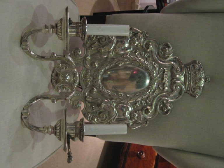 Beautiful pair of silver plated sconces with cherubs