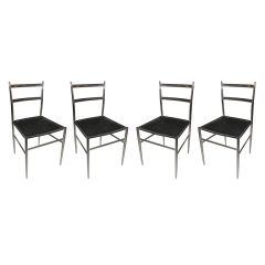 Four Gio Ponti Chrome And Woven Vinyl Chairs