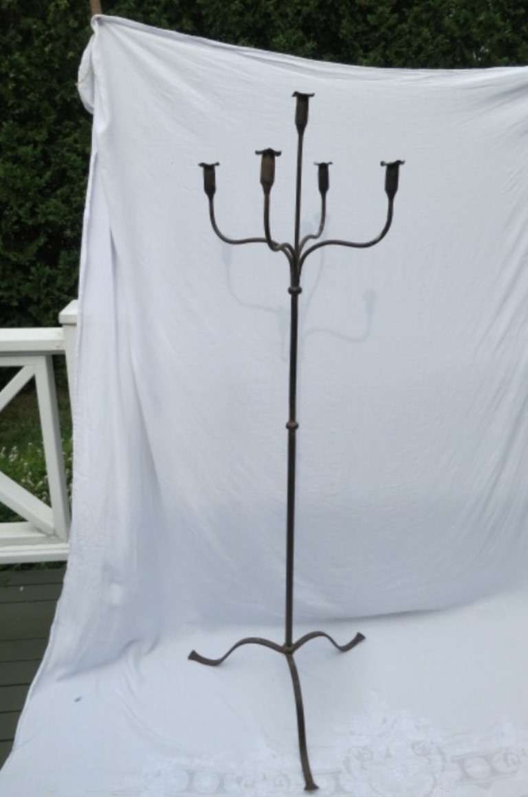 Early 19th century primitive iron candelabrum five light with splayed feet.
