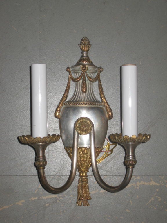 Urn shaped sconces with silver plated finish