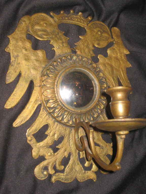 Set of 8 gilt bronze sconces with convex mirror insets. Priced by the pair