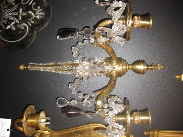 Fabulous double light sconces with rock crystal and amethyst hangings.Unusual crystal beading.Four pairs are available. Priced per pair
