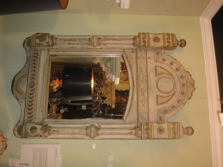 Carved and painted mirror