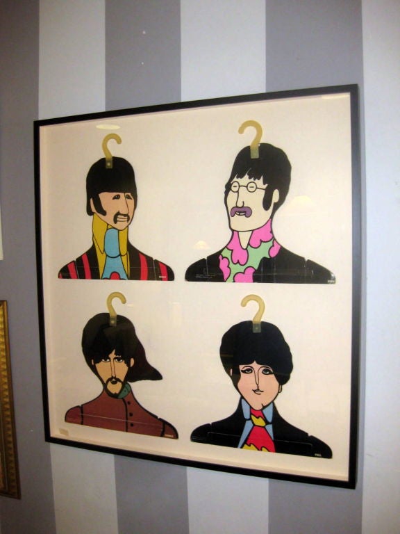 Four Yellow Submarine Beatles hangers framed under glass