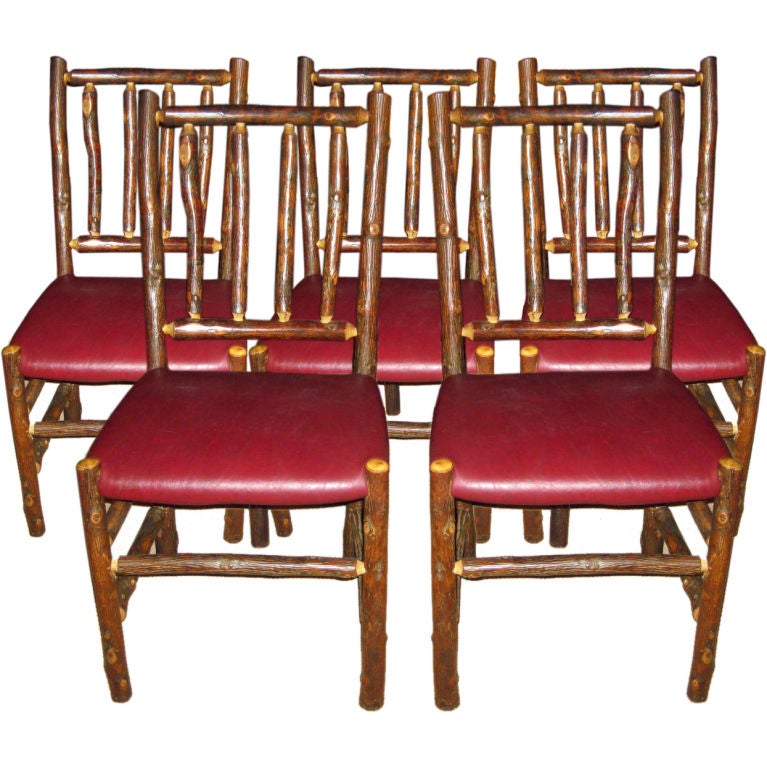 Nine Adirondack Dining Chairs With Leather Seats For Sale