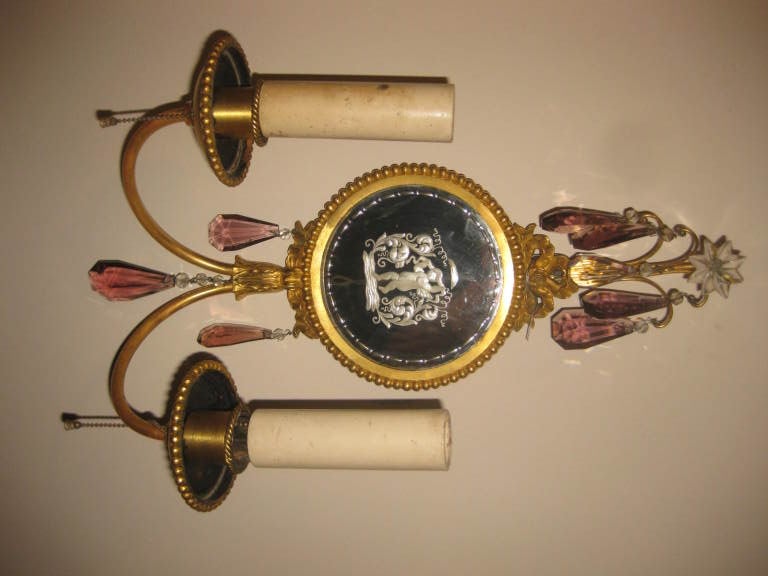 Pair of sconces with mirrored backplate, original gilding and patina