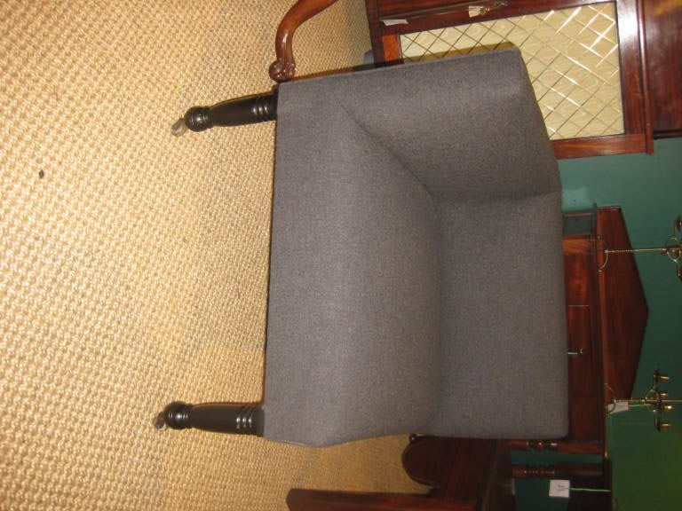 Ebonized corner chair on original casters, newly reupholstered in cashmere/wool