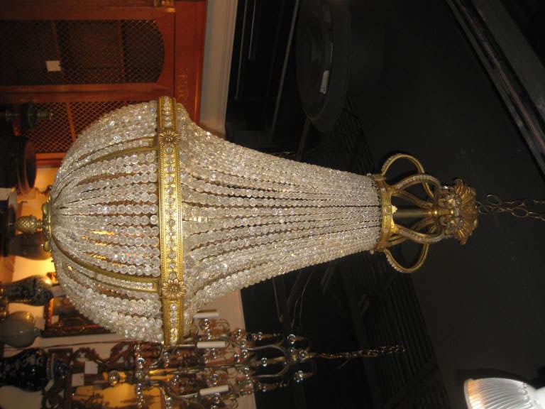 A crystal and bronze chandelier. As is.